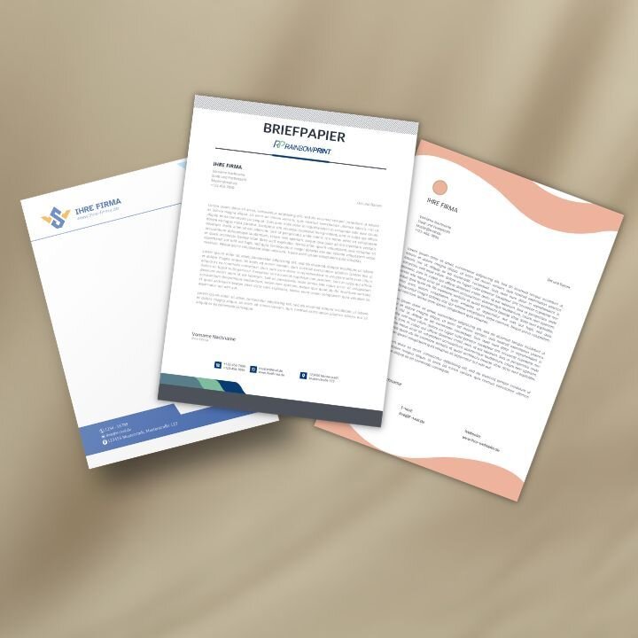 Verschiedene Briefb�gen von Rainbowprint, die aufeinander liegen.